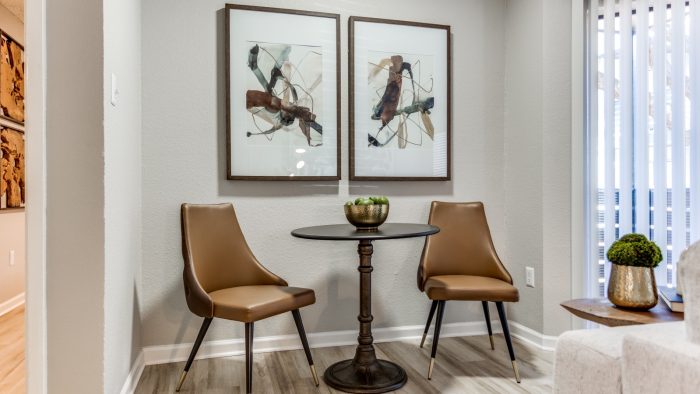 a dining room with two chairs and a table at The The Huxley